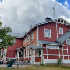 Big old red wooden house, old school.